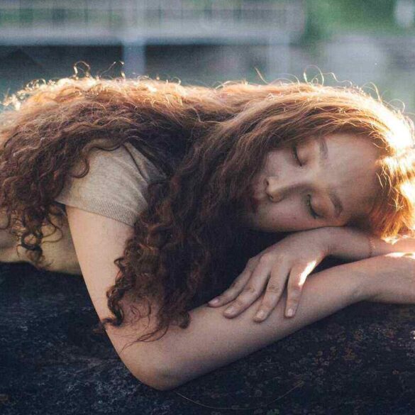 woman lying outside enjoying the sun