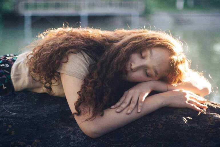 STOPPING SELF-ABANDONMENT: Including ourselves in the circle of compassion 20 woman lying outside enjoying the sun