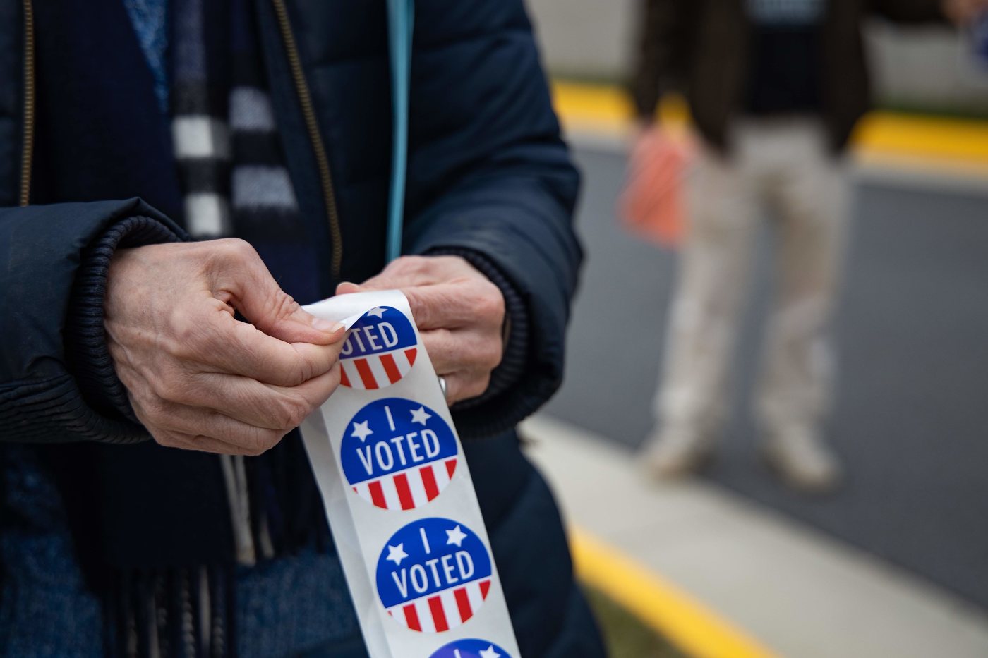 A SENSE OF CARING: Without it, there can't be a sense of community 13 Person with "I VOTED" stickers at 2020 U.S. election polling station - A SENSE OF CARING: 4 responsibilities Americans must uphold