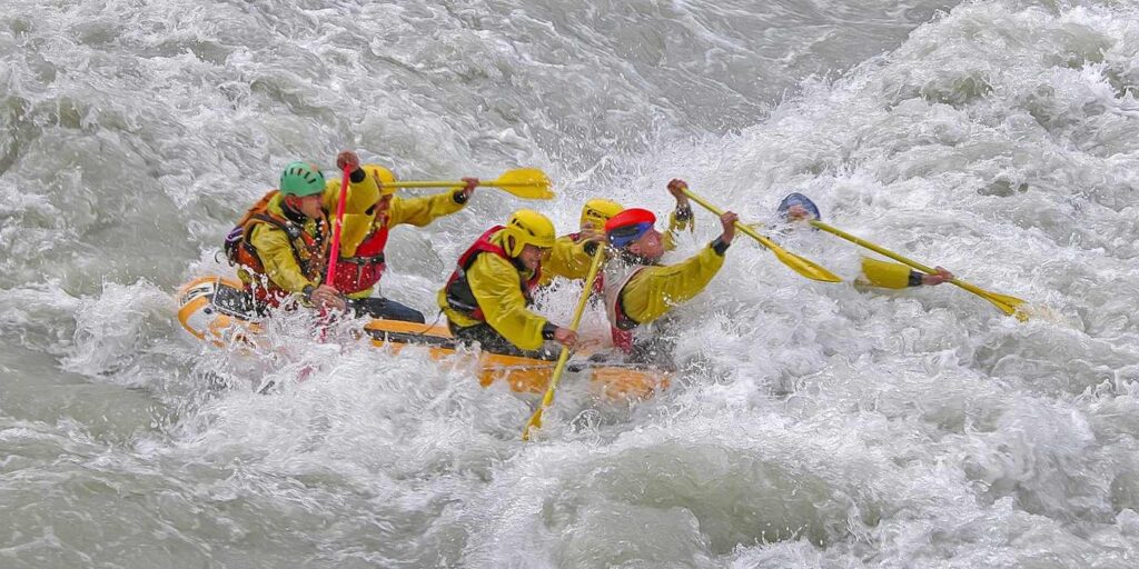 STOICISM FOR INNER PEACE: Living life in the moment with equanimity 14 Five people paddling through rapids in raft - Stoicism for Inner Peace: Let the 4 Basic Virtues Guide You