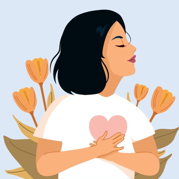 Woman holding heart in front of self, expressing self-love