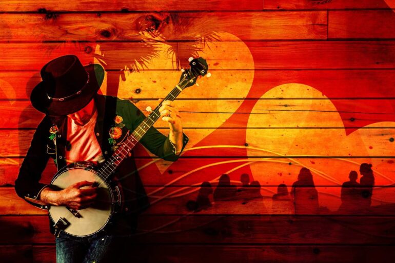 Man playing banjo with hearts in background