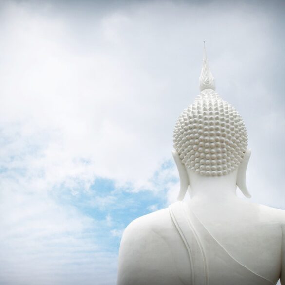 Head of Buddha statue facing clouds - Welcoming Beginner’s Mind: A Helpful Book on Buddhist Wisdom