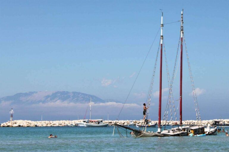 Two-mast sailboat sinking