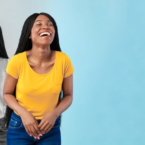 Happy young woman with sad version of same woman behind her - A Spiritual Teacher’s Guide to Releasing Emotional Prisoners
