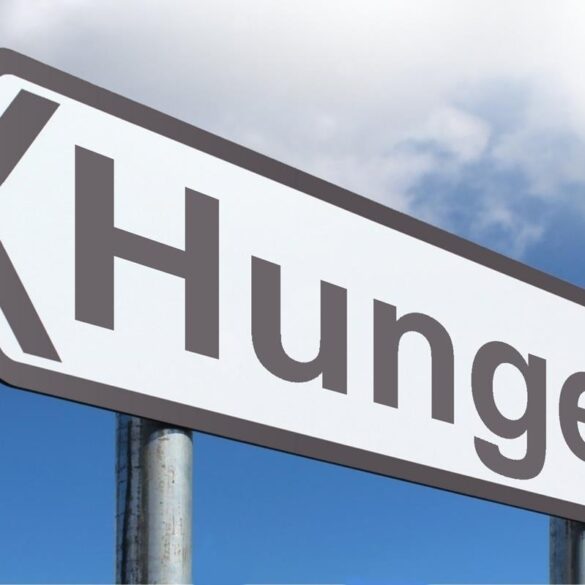 Road sign HUNGER - Food Waste: The Problem With Food Fights and Eating Contests
