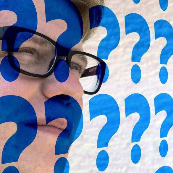 man's face covered in question marks - Stay Grateful for Uncertainty in an Ever-Changing World