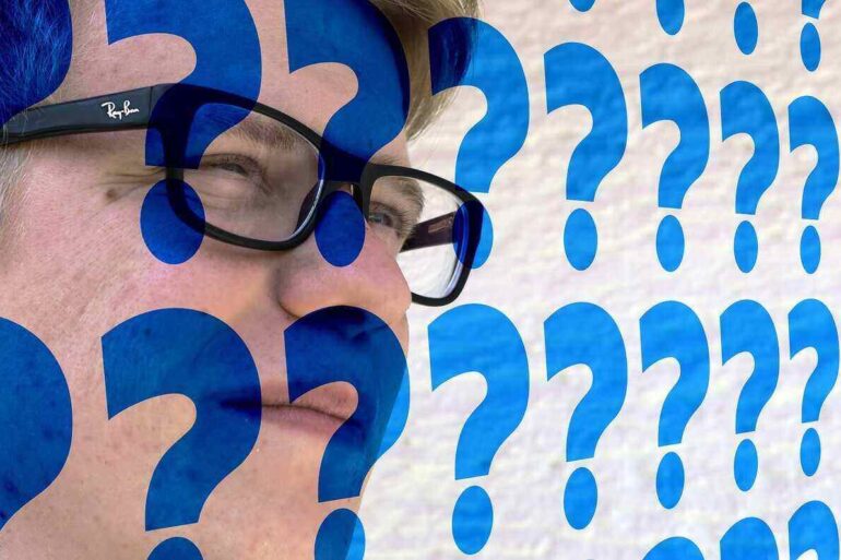 man's face covered in question marks - Stay Grateful for Uncertainty in an Ever-Changing World