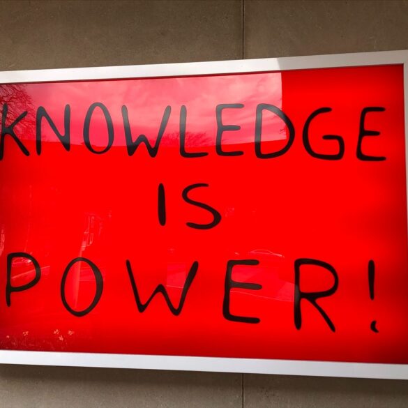 "Knowledge is power" on red background - Stronger Together: The U.S. Should Embrace Globalism in 2024