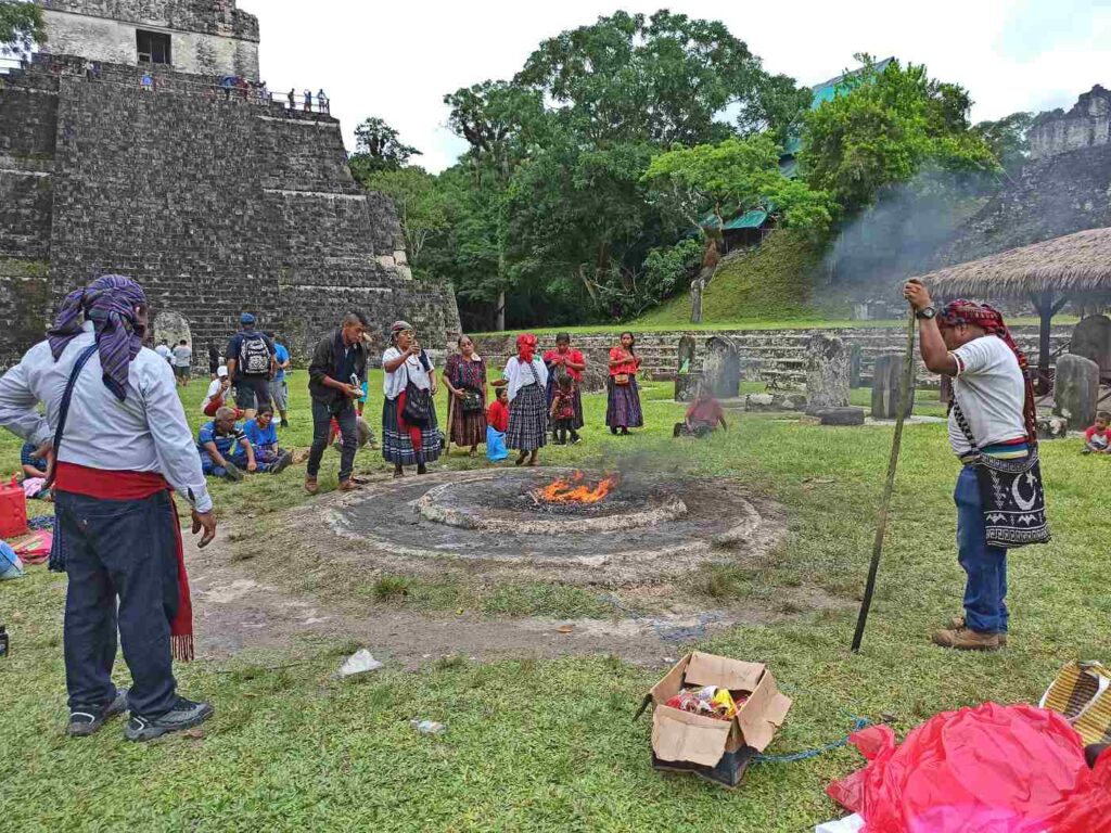 People around a woodless fire at Mayan ceremony - The Mayan Fire Ceremony: 4 Circles of Spiritual Growth 