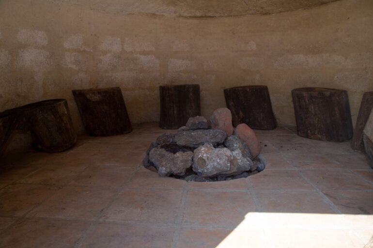 Tree stumps around a pit for a Mayan woodless fire -The Mayan Fire Ceremony: 4 Circles of Spiritual Growth