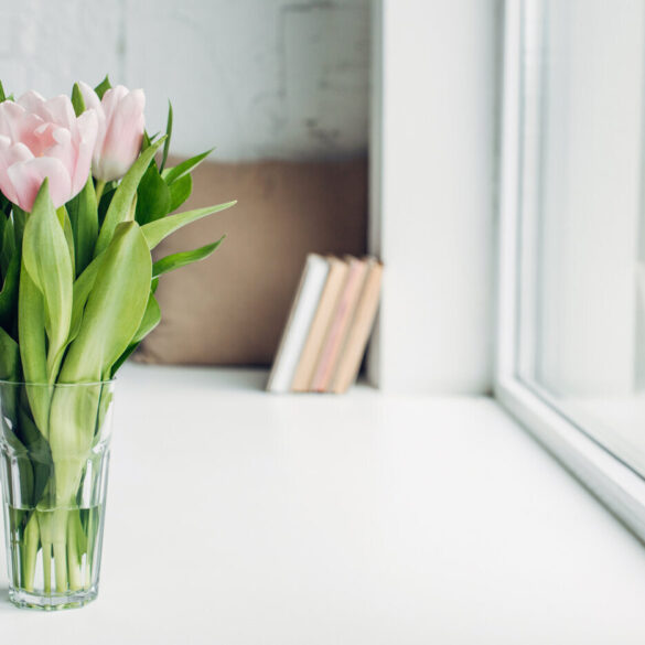 Natural flowers in vase on white windowsill - 13 Kondo-Like Living Tips to Give You Some Breathing Room
