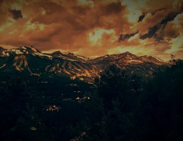 Mountains with clouds above - Choosing Collective Action Over Power Can Save Our Planet