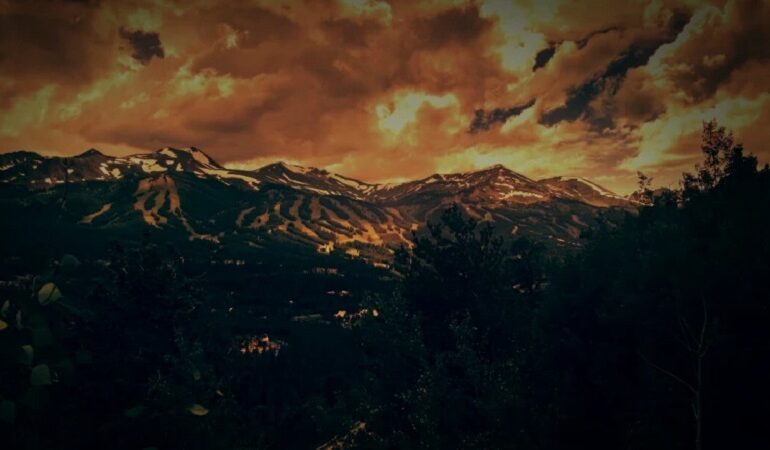 Mountains with clouds above - Choosing Collective Action Over Power Can Save Our Planet