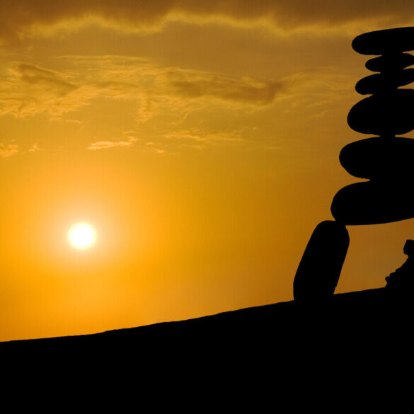 Silhouette of person meditating under rocks - Collaborative Problem-Solving, Mindfulness and Technology
