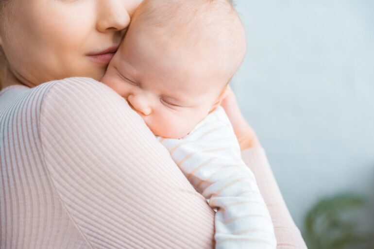 Mother with new baby - Finding Hope: How to Overcome Your Postpartum Struggles
