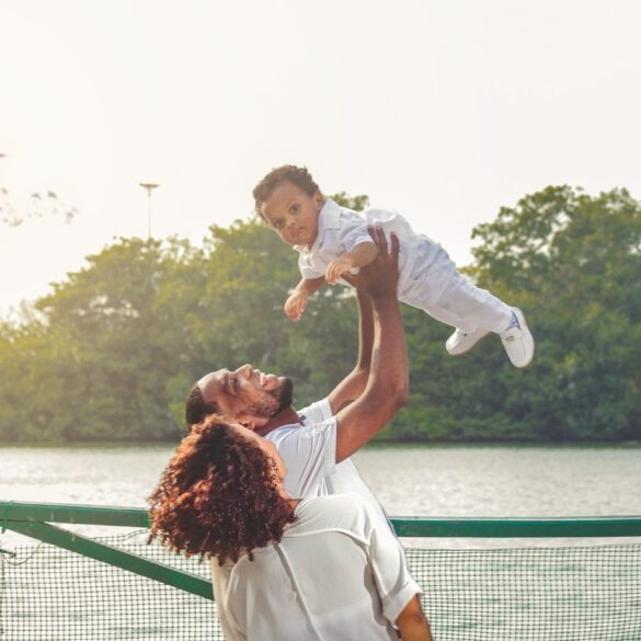 Mother, father and child, with child being lifted by father - Conscious Parenting: 5 Great Ways to Improve Your Skills