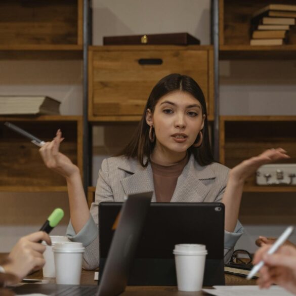 Three women having a business meeting - Speaking Out: A Human Trafficking Survivor Fosters Change