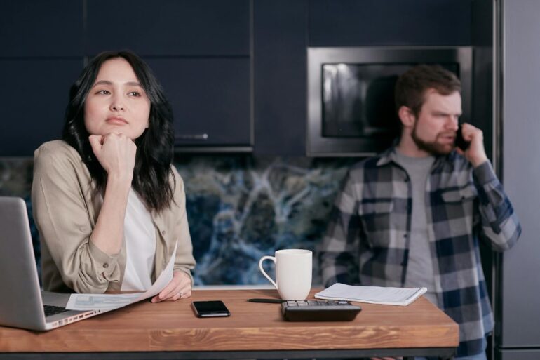 Annoyed couple using cell phones - The Middle Ground: How to Avoid Oversharing on Social Media