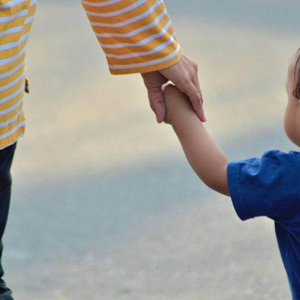 Parent and child holding hands outdoors - 5 Big Things to Remember When You Feel Like a Bad Parent