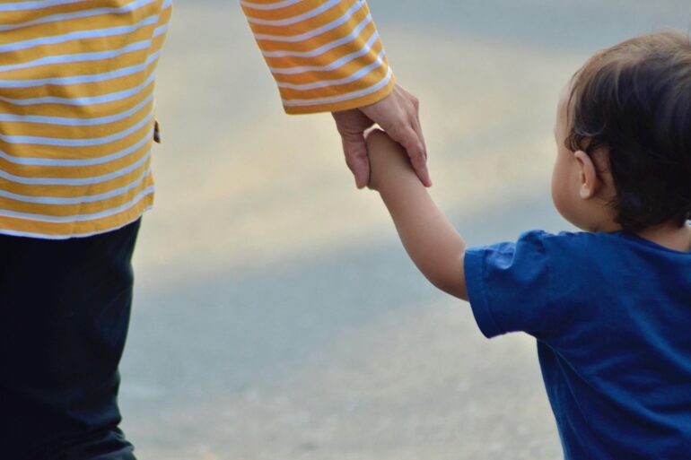 Parent and child holding hands outdoors - 5 Big Things to Remember When You Feel Like a Bad Parent