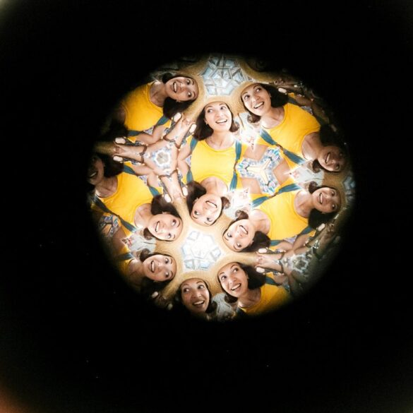 Multiple instances of woman's face showing through kaleidoscope lens - The Hypothetical Self: It’s Just a Powerful Illusion
