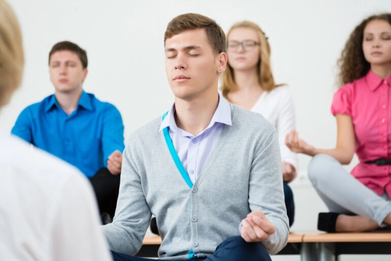 Small group of young adults meditating - Full Remission: 2 Mindful Therapy Techniques Healed My BPD