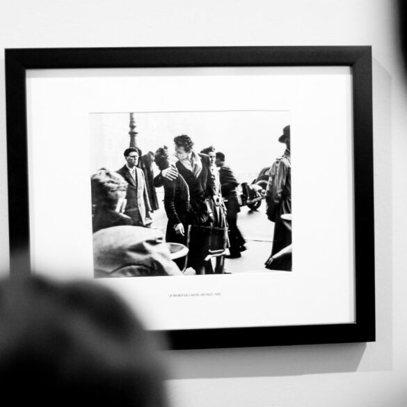 Person looking at black and white picture in frame - What Is Nostalgia for the Present and How Can It Help Us?