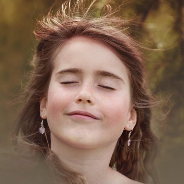 Young woman with eyes closed meditatively - Attunement: Quiet Seeing That Occurs Before the Eyes Open
