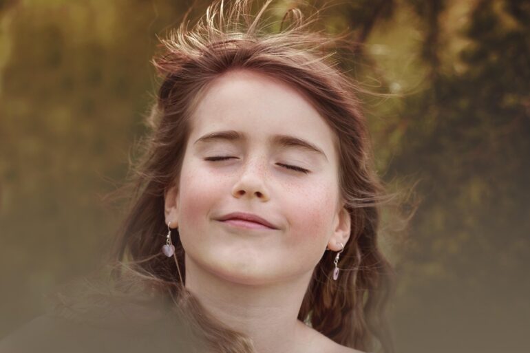 Young woman with eyes closed meditatively - Attunement: Quiet Seeing That Occurs Before the Eyes Open
