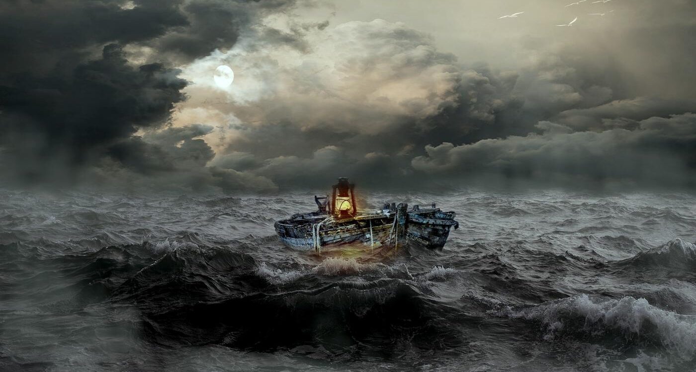 Boat with lantern floating in stormy water - The Path to Inner Simplicity Starts With Mindfulness