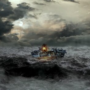 Boat with lantern floating in stormy water - The Path to Inner Simplicity Starts With Mindfulness