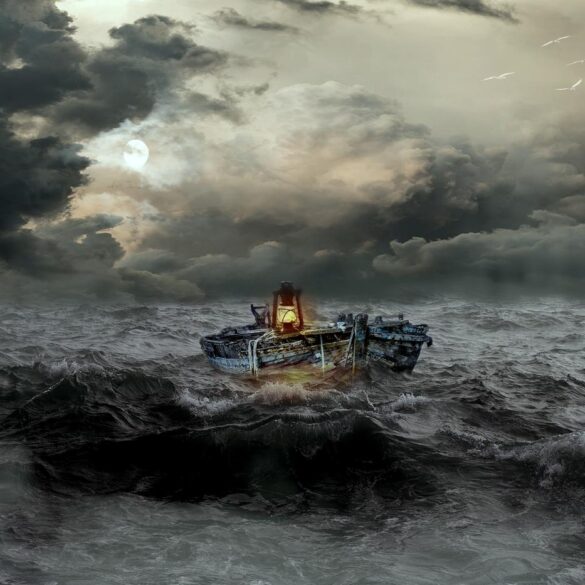 Boat with lantern floating in stormy water - The Path to Inner Simplicity Starts With Mindfulness