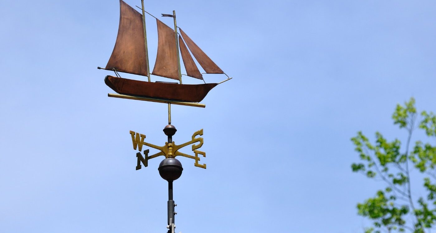 Sailboat-shaped weathervane on a roof - Mindfulness Practice Is Worth It—Despite the Hidden Cost