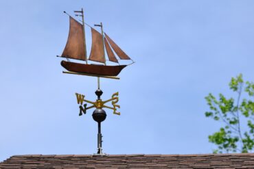Sailboat-shaped weathervane on a roof - Mindfulness Practice Is Worth It—Despite the Hidden Cost