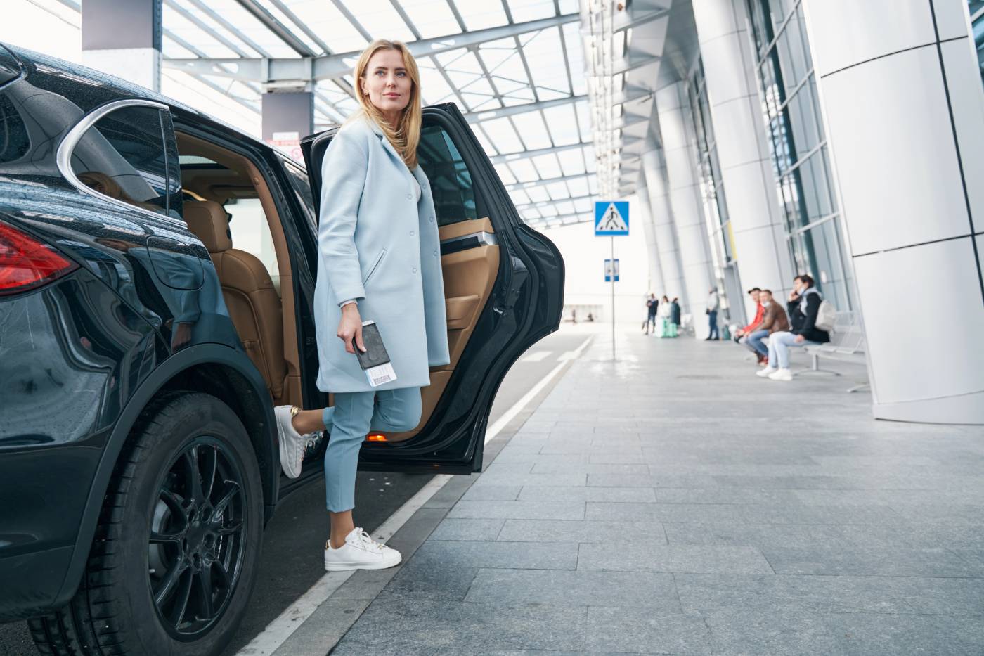 MINDFULNESS TAKES WORK: But it's the best and most important work you'll ever do 14 Woman getting out of car at airport and pausing - Mindfulness Practice: The Most Important Work You’ll Ever Do