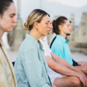 Small group of women meditating - How to Avoid the Subtle Pressure That Mindfulness Can Bring