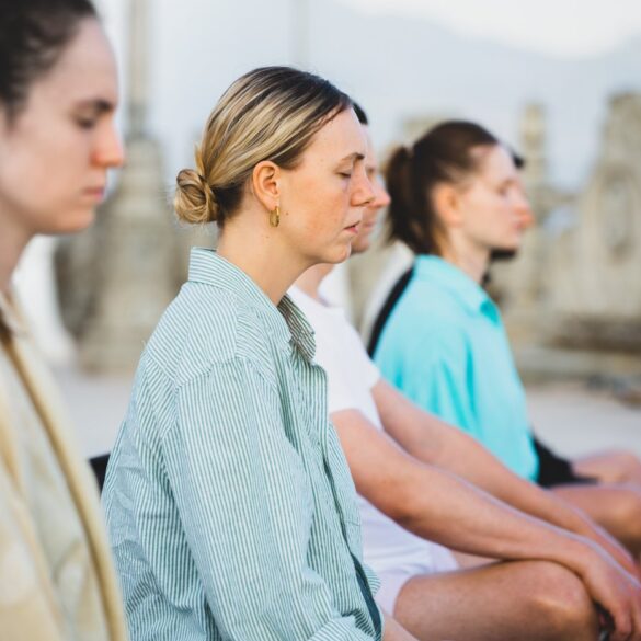 Small group of women meditating - How to Avoid the Subtle Pressure That Mindfulness Can Bring