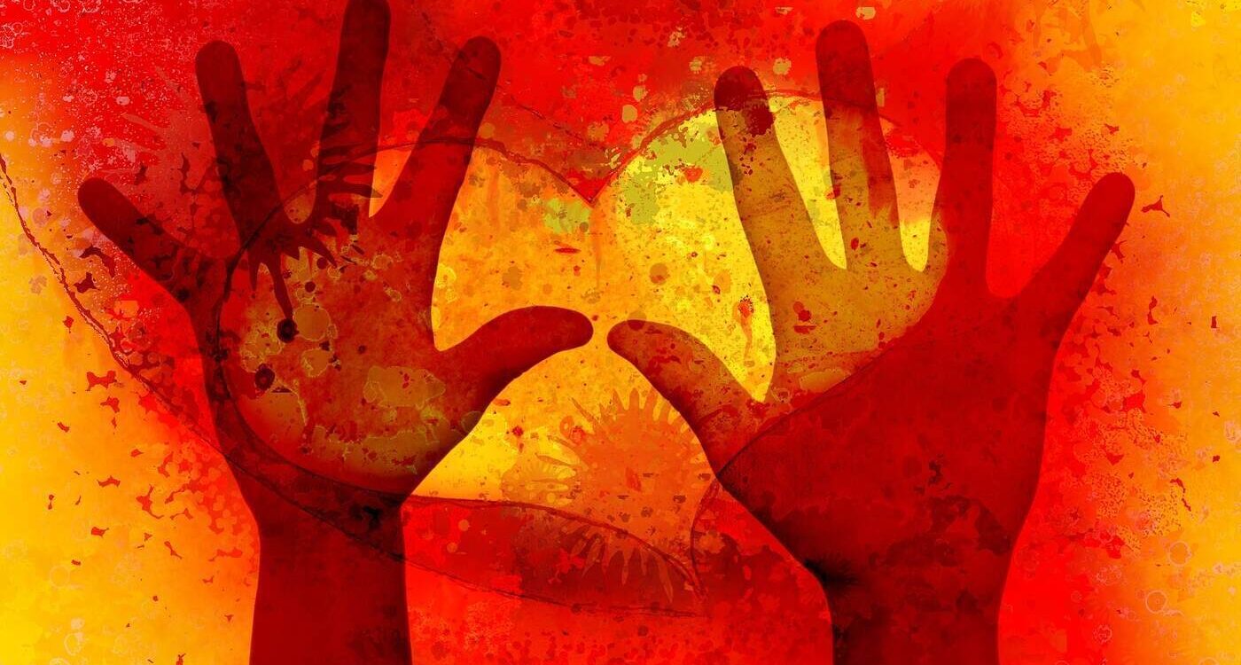 Hands against background of a heart - Travelling With Intention: Why Is It So Important?