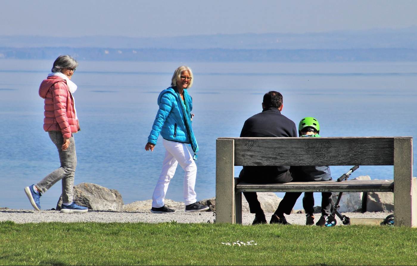 RECLAIM YOUR TIME THROUGH PRESENCE: 5 research-backed ways to do so 13 Two senior women, a man and a child spending time outdoors - Get Creative—And More—To Reclaim the Present Moment
