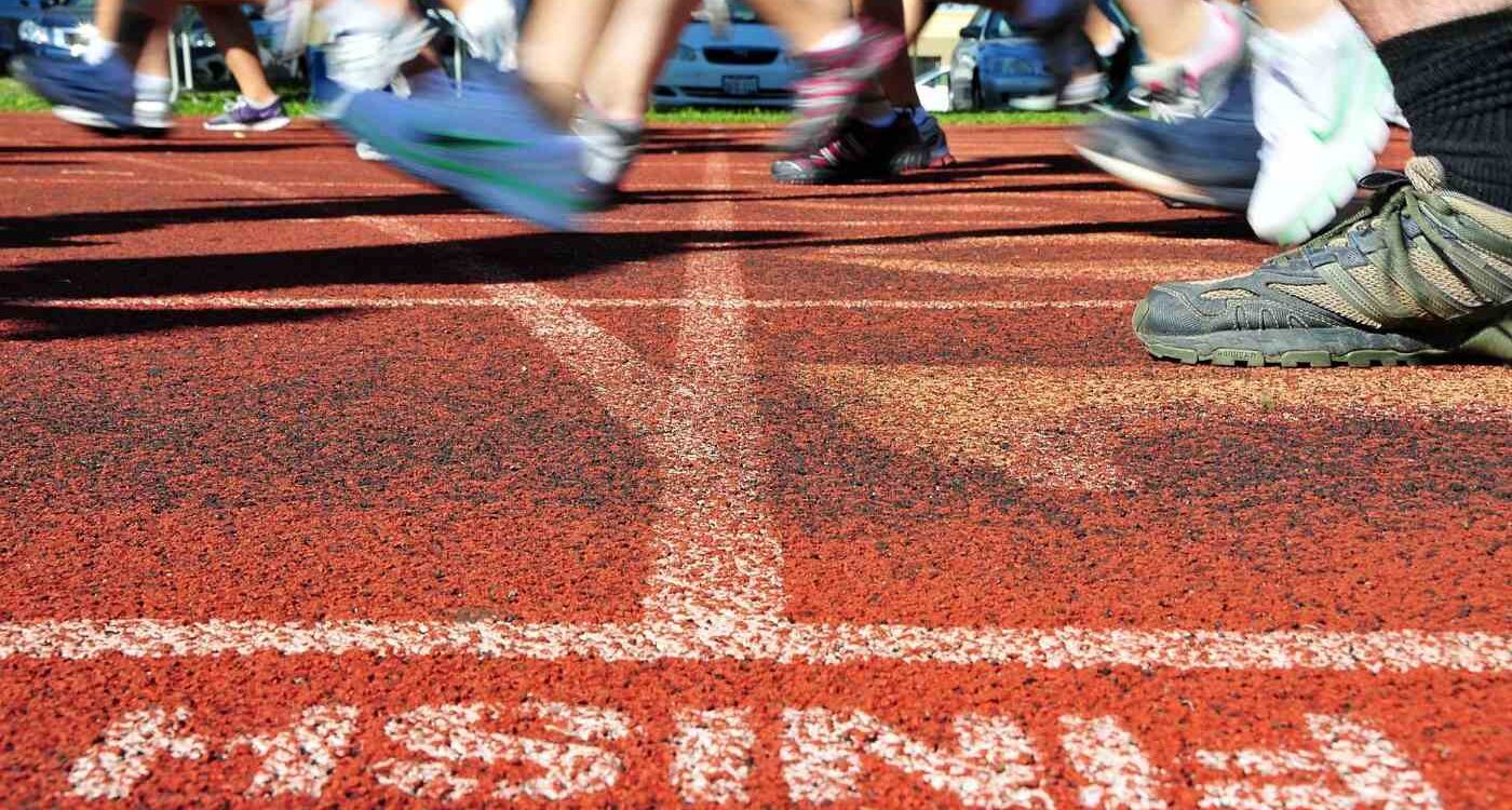 Runners crossing finish line outdoors - Finish Line: A Blissful Return to Triathlon After 10 Years