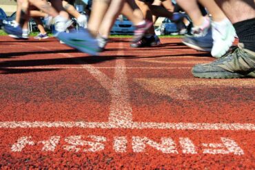Runners crossing finish line outdoors - Finish Line: A Blissful Return to Triathlon After 10 Years