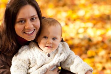 Mother and baby boy outdoors - New Rituals: Finding Peace With My Baby After Birth