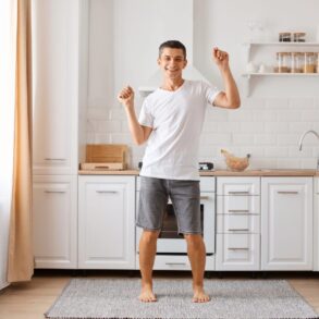 Young man dancing silly in kitchen - Where Happiness Begins: Calm Yourself in 15 Minutes or Less