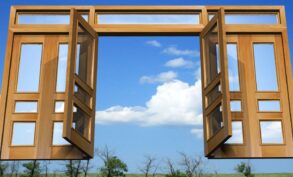 Wooden gates floating in clouds above trees - Energy Gates: 3 Helpful Ways to Control What Passes Through