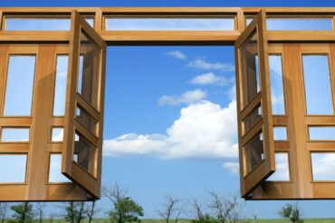 Wooden gates floating in clouds above trees - Energy Gates: 3 Helpful Ways to Control What Passes Through