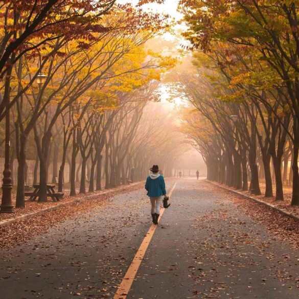 Woman walking down road with gold and green trees - "My Daily Walk" and 4 More Authentic Poems About the World