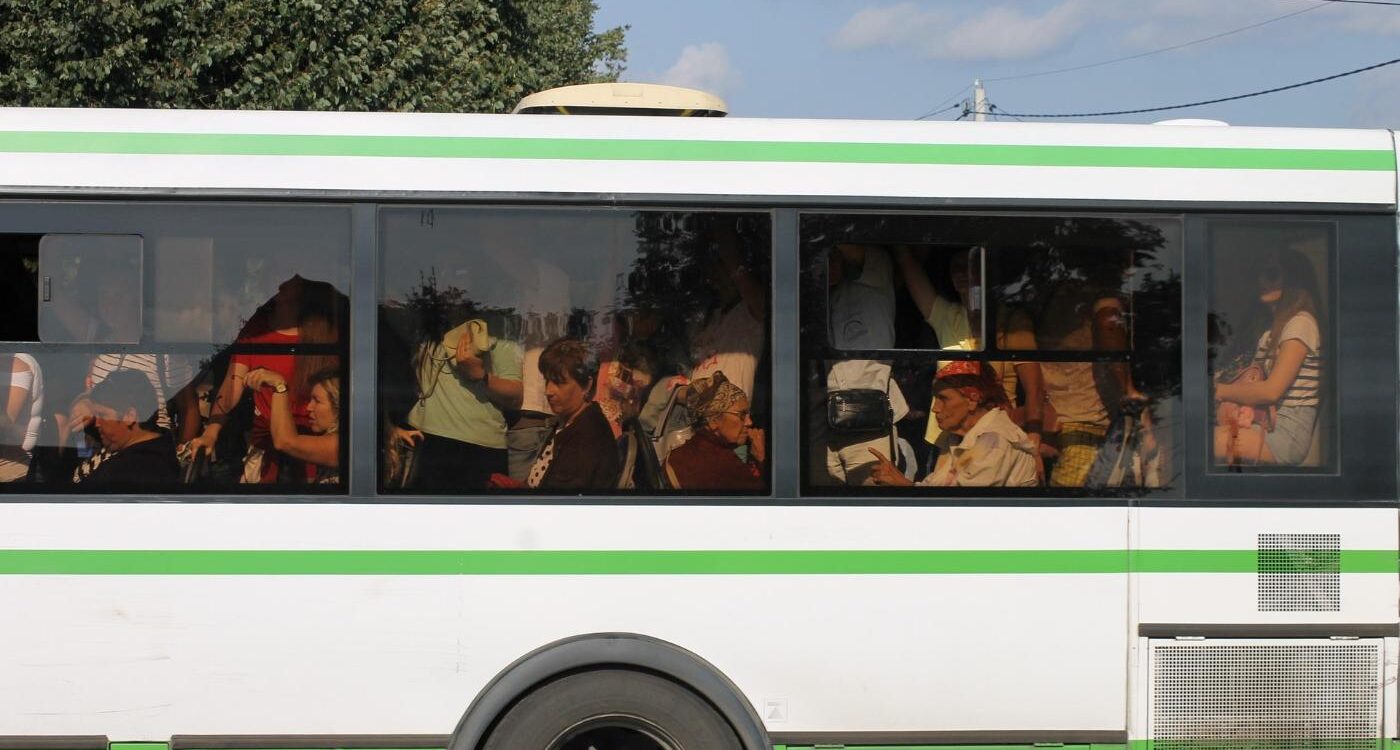 Outside view of public bus crowded with riders - Renunciation: How the 4 Noble Truths Can Help You Practice