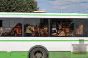 Outside view of public bus crowded with riders - Renunciation: How the 4 Noble Truths Can Help You Practice