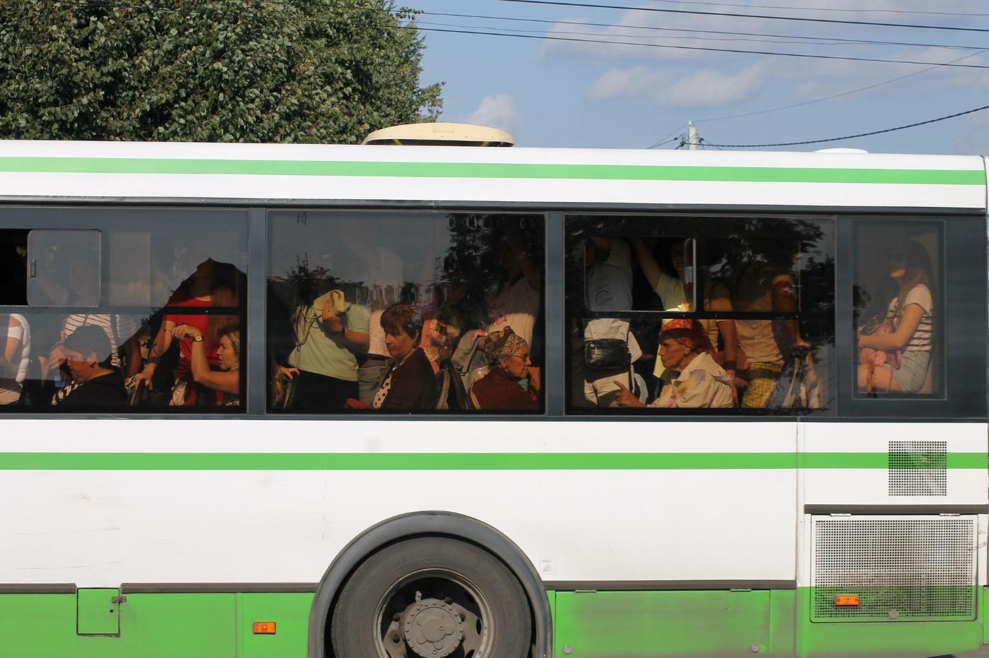 RENUNCIATION: How to practice it with the help of the Buddha's Four Noble Truths 13 Outside view of public bus crowded with riders - Renunciation: How the 4 Noble Truths Can Help You Practice